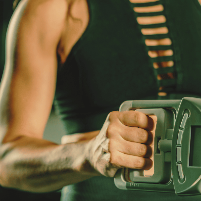 A woman gripping an exercise tool